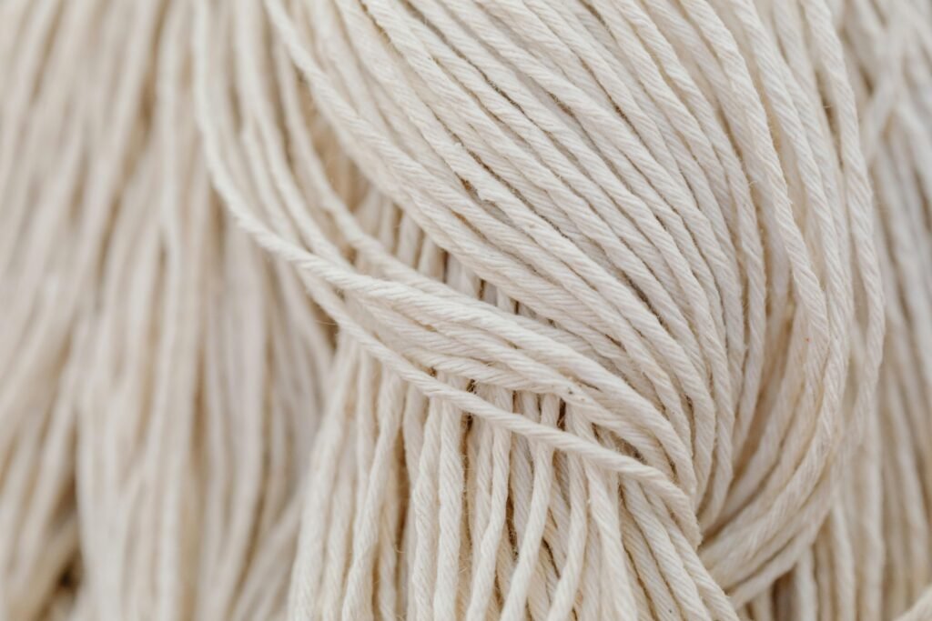 Detailed view of white yarn in a tangled arrangement. Perfect for crafting themes.